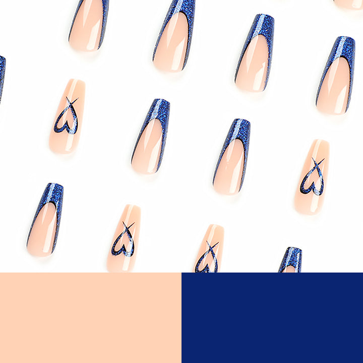 Artificial nails with glitter accents and unique heart design Stornfield
