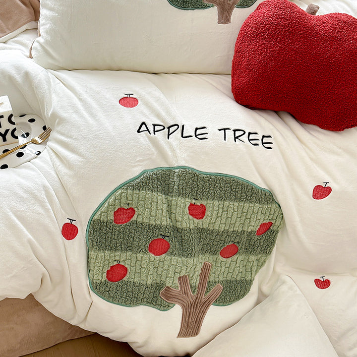Bedding set made of soft cotton with embroidered apple tree motif and cuddly apple pillow