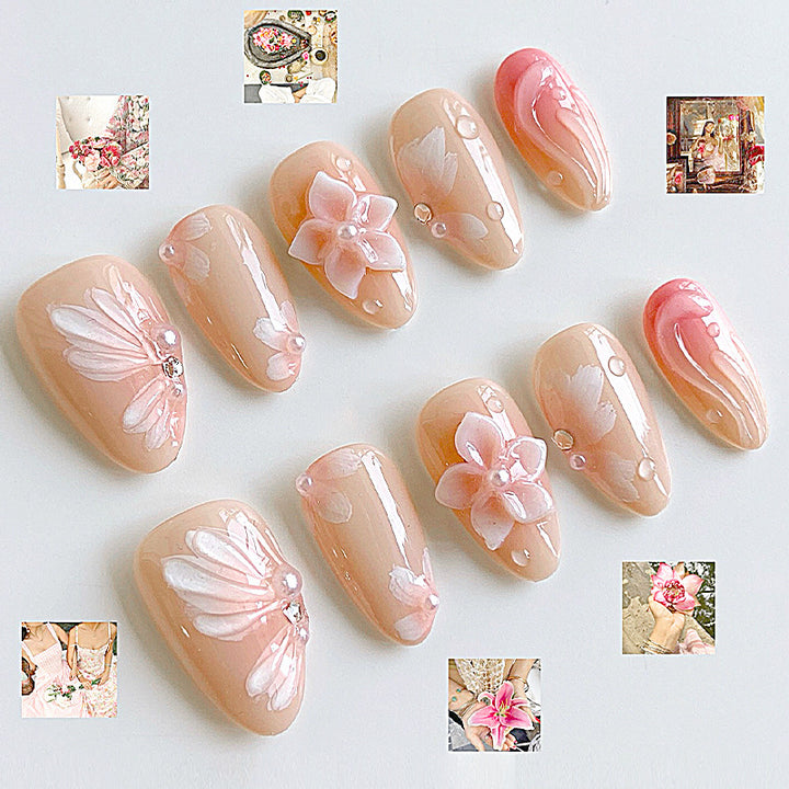 Artificial nail set with floral motifs and rhinestone decorations Stornfield