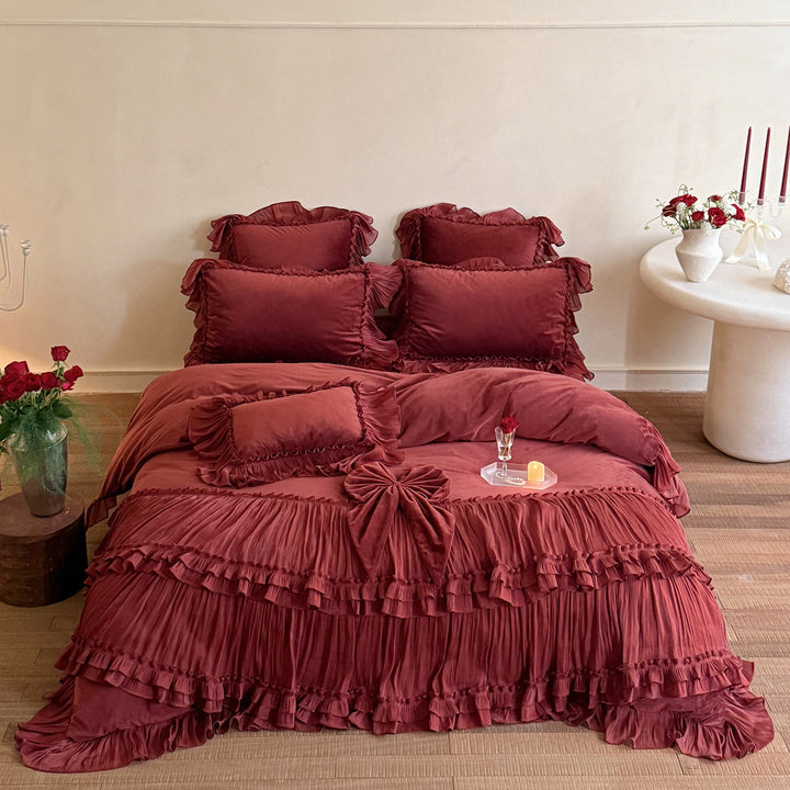 Romantic ruffled velvet bed set with pleated frills and decorative cushions