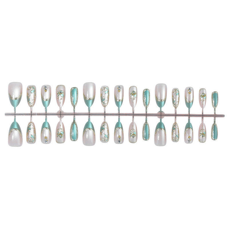 Artificial nail set with luxurious flower appliqués and glitter accents Stornfield