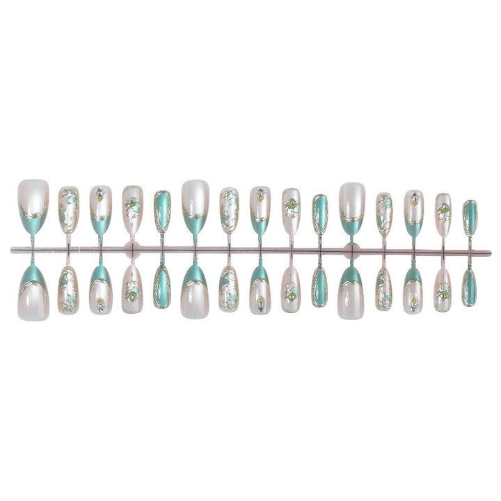 Artificial nail set with luxurious flower appliqués and glitter accents Stornfield