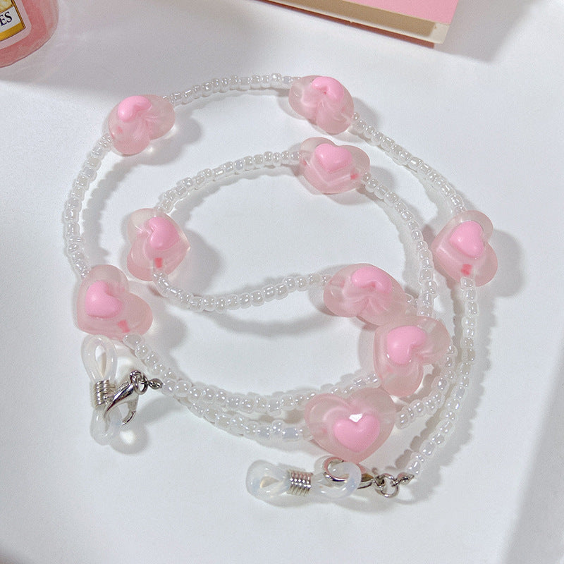 Fashionable glasses strap with heart pendants Stornfield