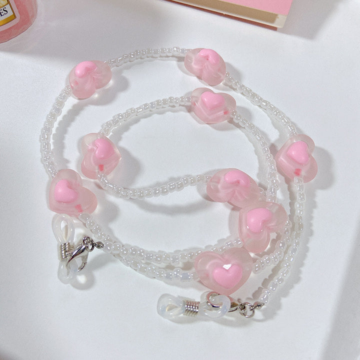 Fashionable glasses strap with heart pendants Stornfield