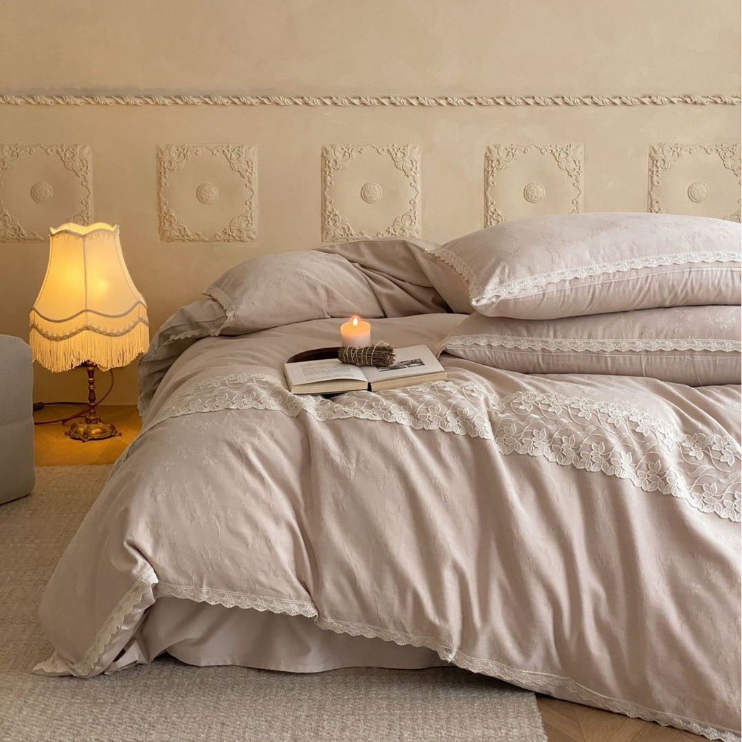 Embroidered cotton satin bed linen set with lace ruffle and subtle jacquard relief