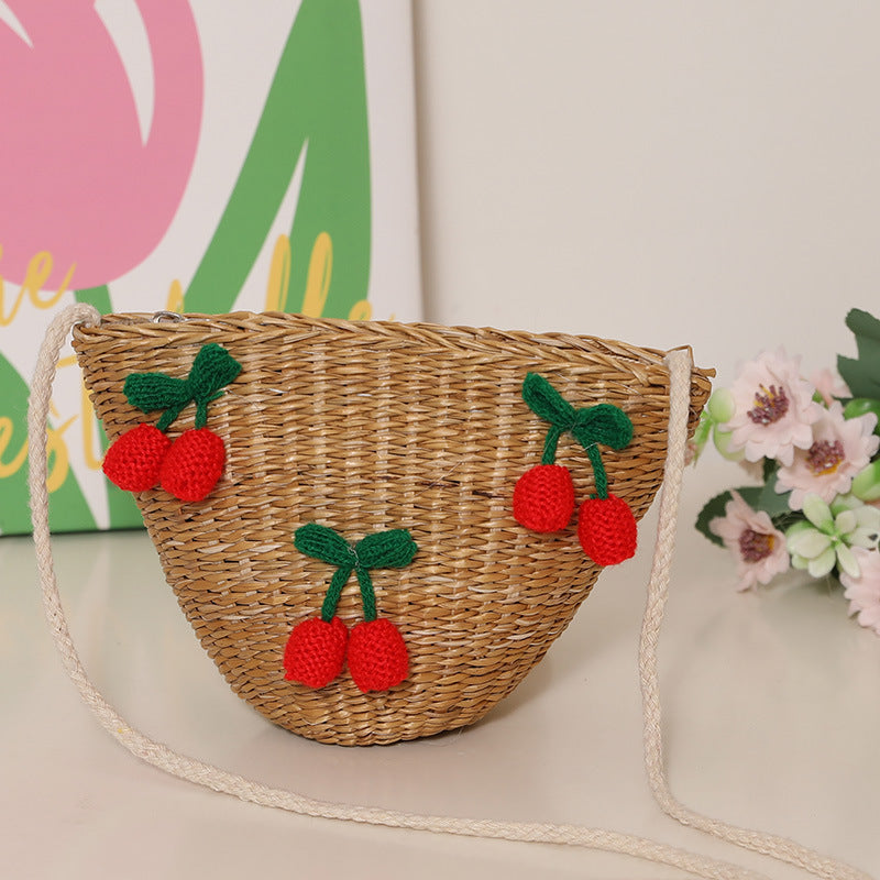 Playful straw shoulder bag with floral accents Stornfield