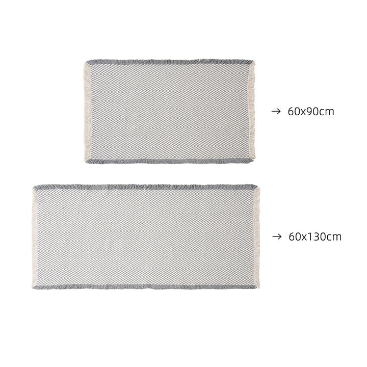 Handwoven cotton bath mat with herringbone pattern and fringes Stornfield