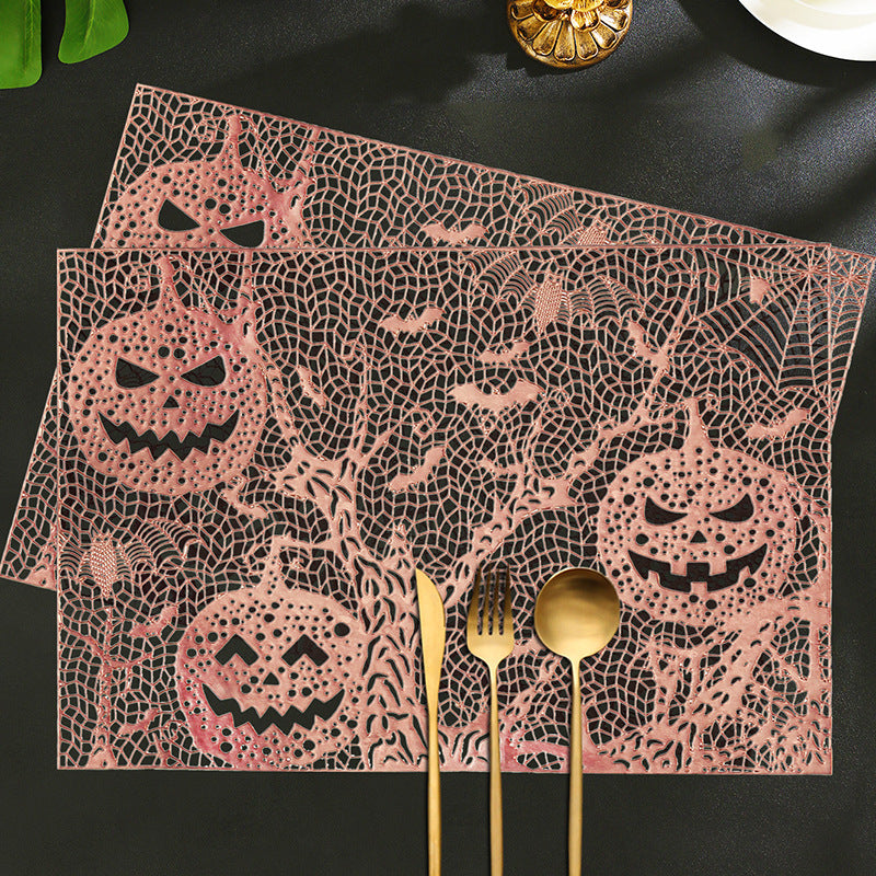 Halloween plastic table mats with intricate pumpkin and spider web design