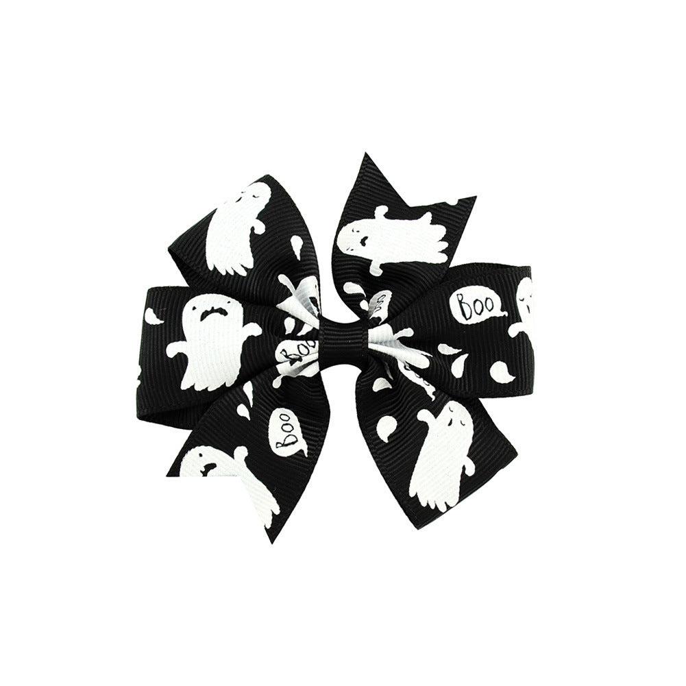 Halloween bow with pumpkin and witch motifs