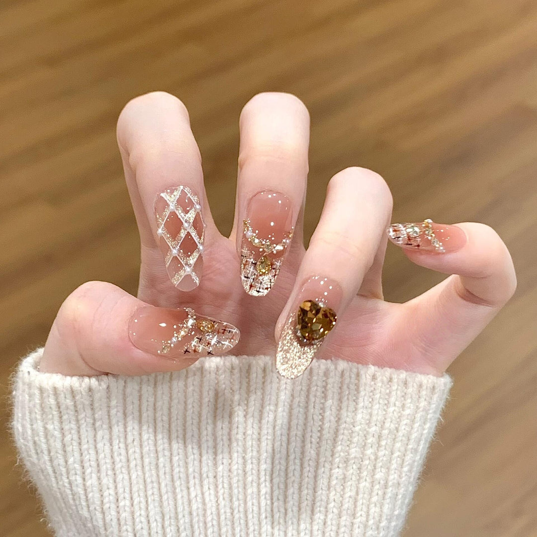 Glamorous artificial nails with glitter and heart design Stornfield