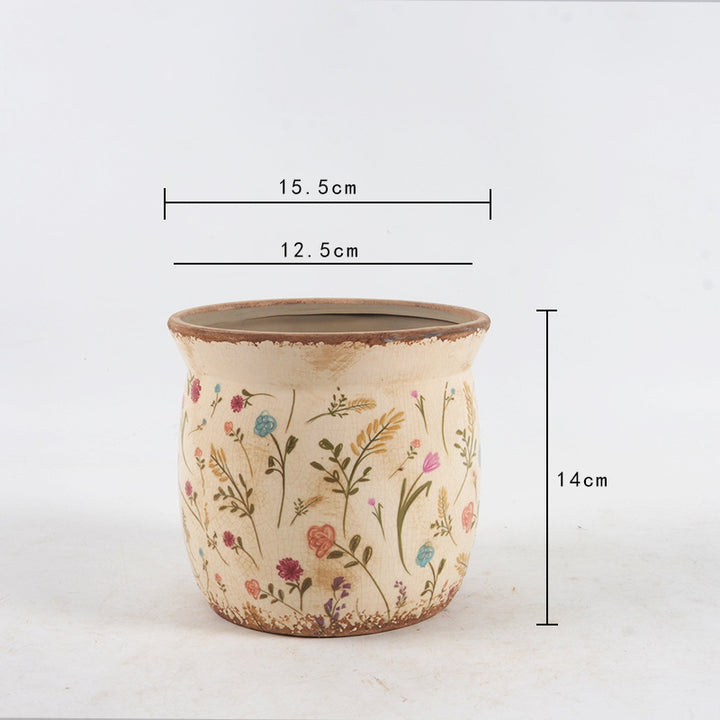 Decorative ceramic plant container with artistic design Stornfield