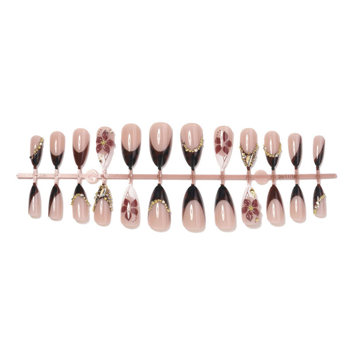 Acrylic nail set with elegant flower and glitter accent Stornfield