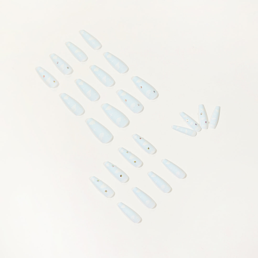 Creative nail art in cloud design with glitter accents Stornfield