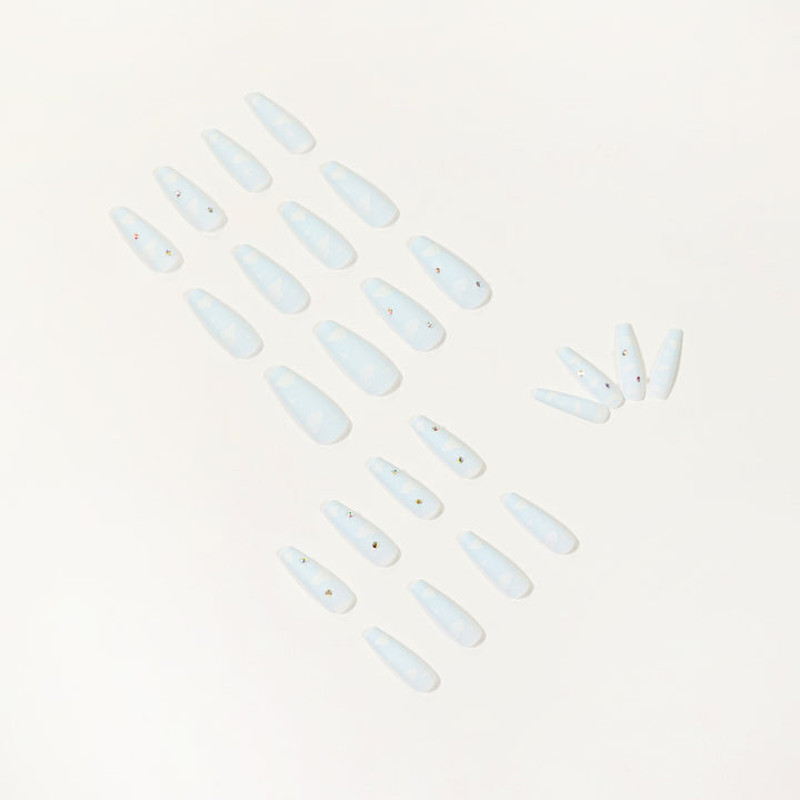 Creative nail art in cloud design with glitter accents Stornfield