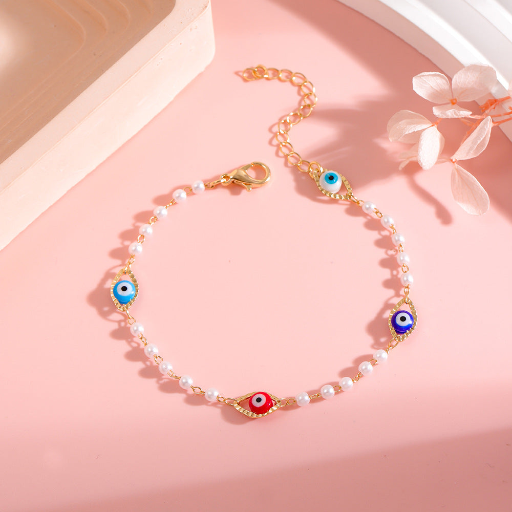 Elegant Pearl and Eye Charm Necklace Stornfield