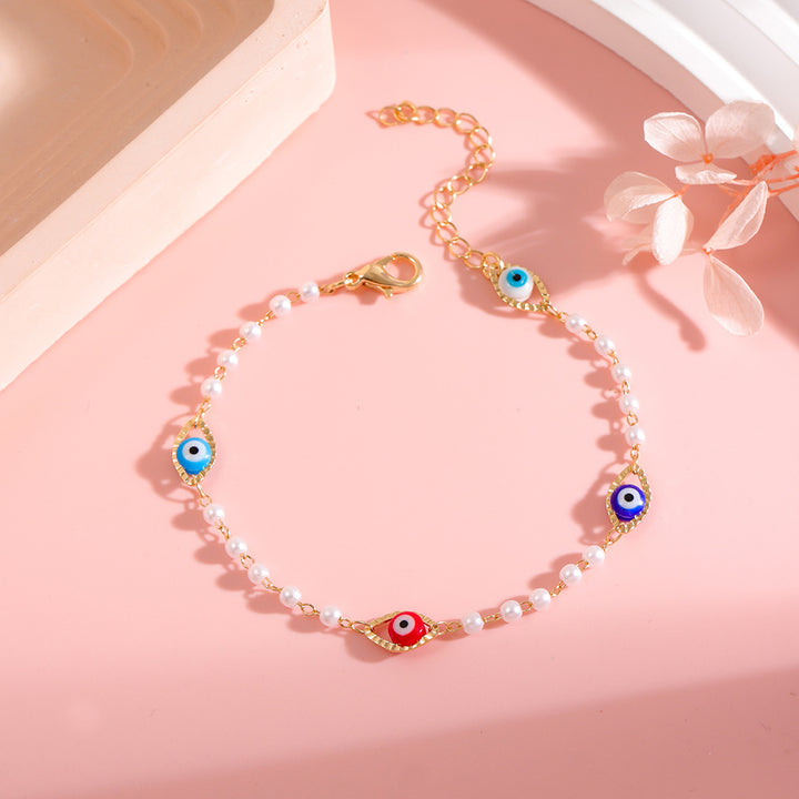 Elegant Pearl and Eye Charm Necklace Stornfield
