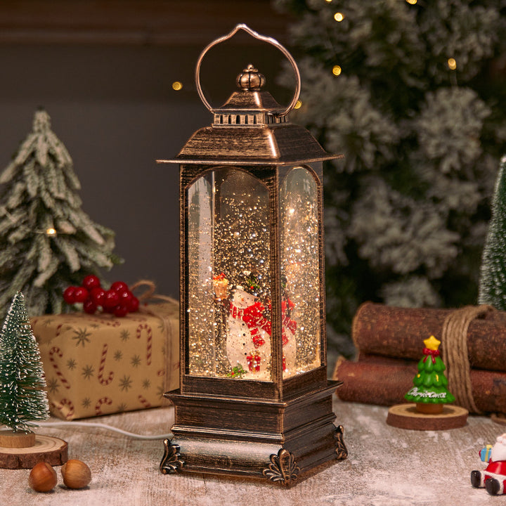 Illuminated Christmas lantern with snow and Christmas motif Stornfield