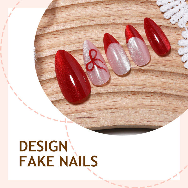 Artificial nail set with elegant red and delicate bow accents Stornfield