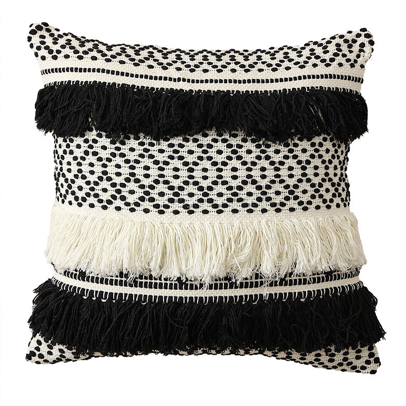 Textured Boho decorative pillow with fringes, tassels, and woven dot pattern