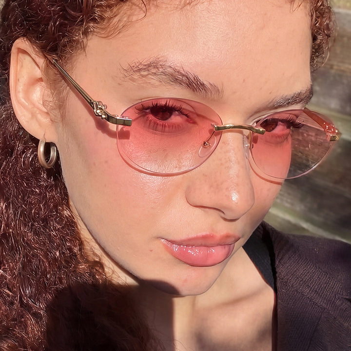 Women's elegant oval sunglasses with golden accents Stornfield