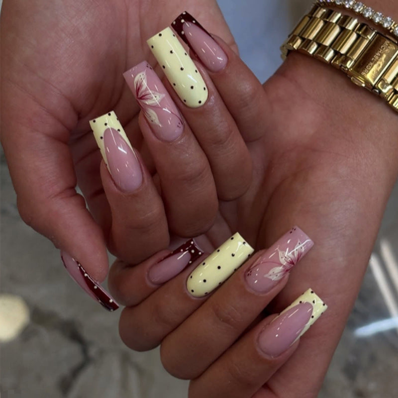 Acrylic nail set with elegant floral and polka dots design Stornfield