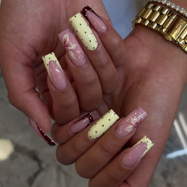 Acrylic nail set with elegant floral and polka dots design Stornfield
