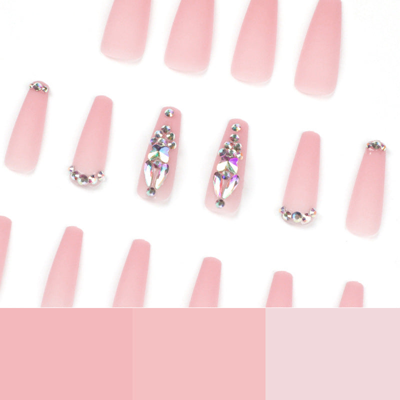 Artistic acrylic nails with glitter and rhinestone embellishments Stornfield