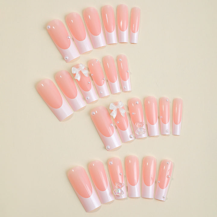 Artificial nail set with elegant 3D bows and glitter accents Stornfield