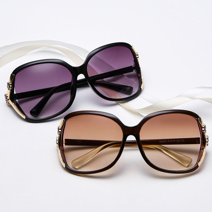 Ladies elegant oversized sunglasses with golden accents Stornfield