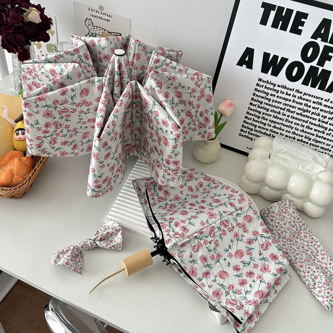 Women's folding umbrella with floral design and practical storage system Stornfield