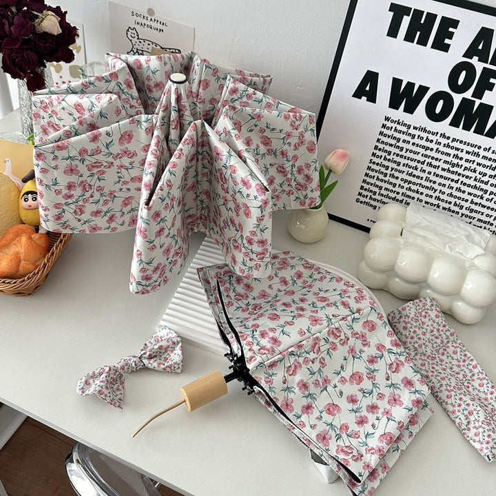 Women's folding umbrella with floral design and practical storage system Stornfield