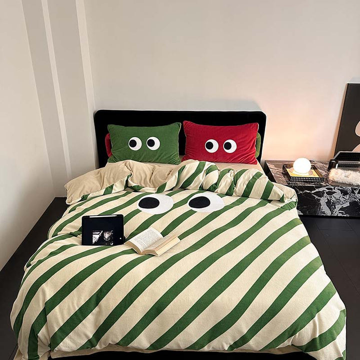 Bedding set with playful eye design and striped cotton linen