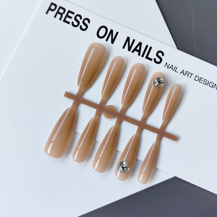 Acrylic nails with glamorous stone accents Stornfield