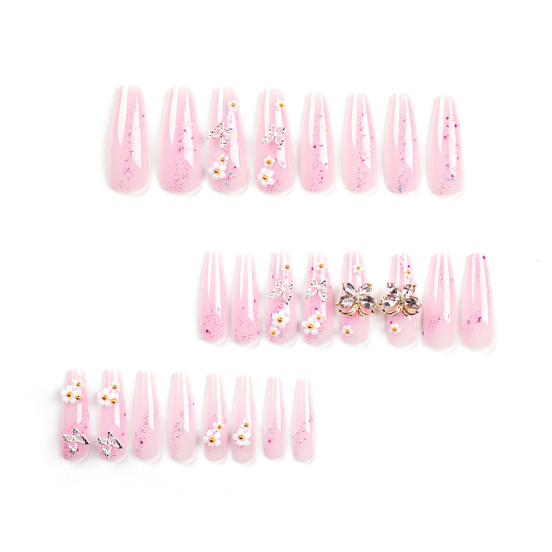 Artistic Nail Extensions with Glitter and Floral Accents Stornfield