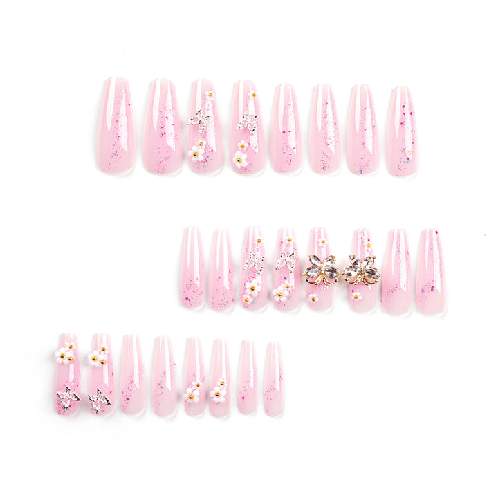 Artistic Nail Extensions with Glitter and Floral Accents Stornfield