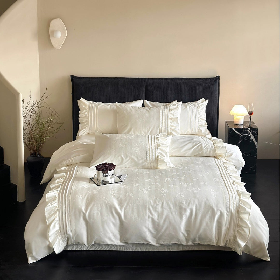 Luxurious satin bedding set with ruffles and delicate floral embroidery
