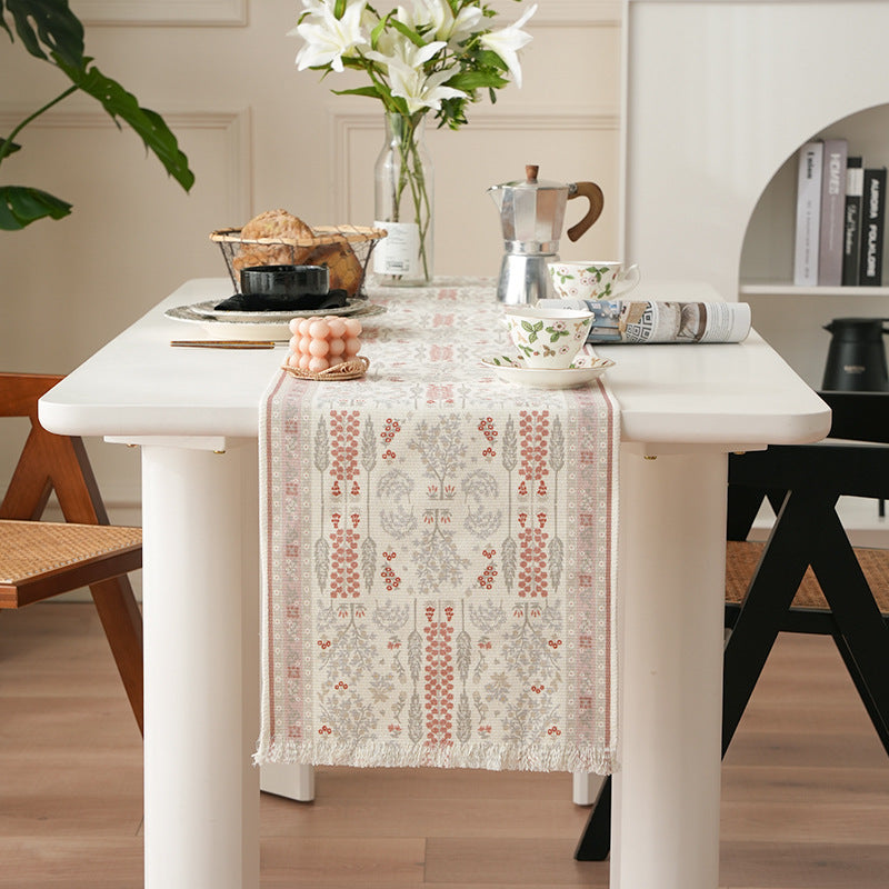 Woven jacquard table runner with floral medallion and fringes Stornfield