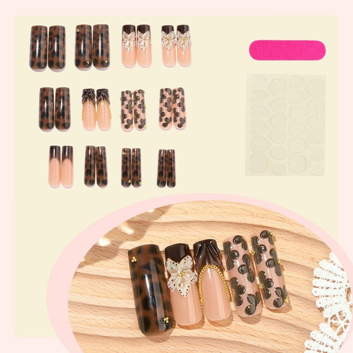 Creative nail art set with glamorous animal motifs and elegant embellishments Stornfield