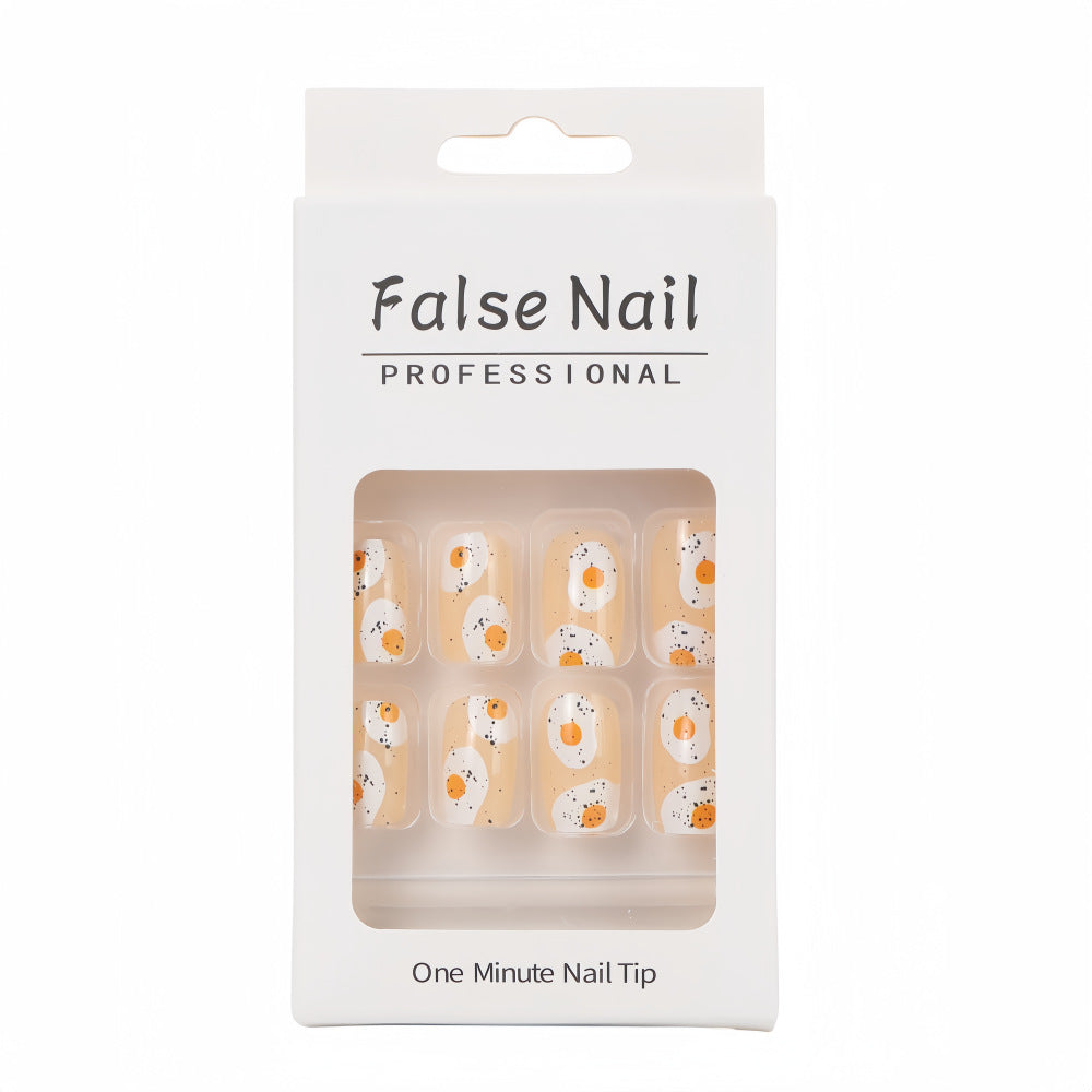 Artificial nails in creative fried egg design Stornfield