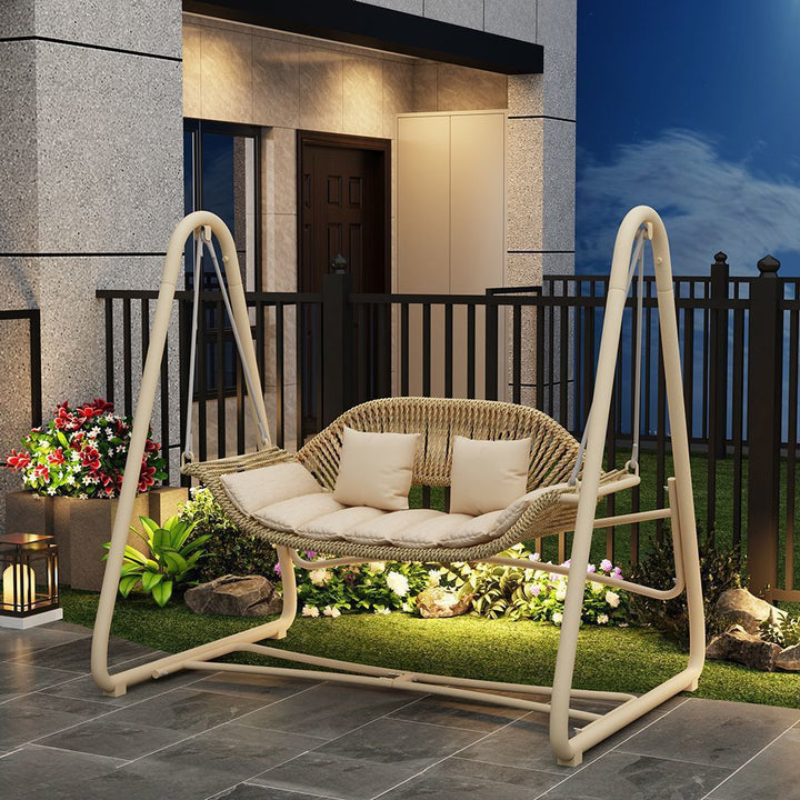Woven rattan outdoor swing loveseat with padded cushions and powder-coated steel frame Stornfield