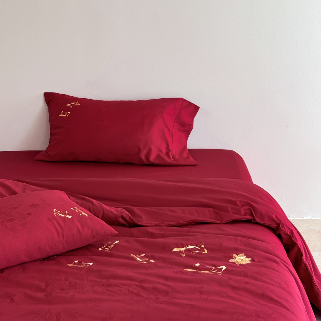 Luxurious bed linen set made of cotton satin with embroidered koi motifs and fine jacquard structure