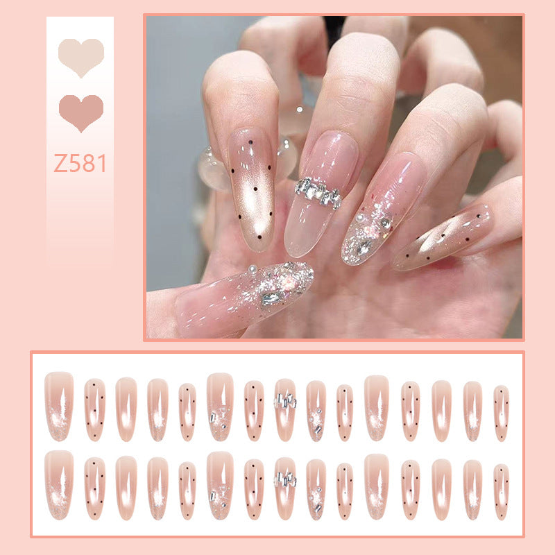 Artificial nail set with sparkling glitter and elegant jewelry details Stornfield