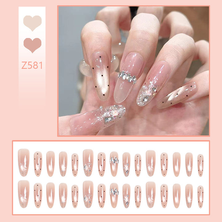 Artificial nail set with sparkling glitter and elegant jewelry details Stornfield
