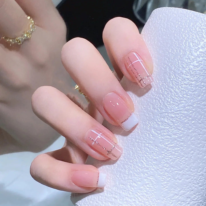 Nail set with elegant French tip and fashionable embellishments Stornfield