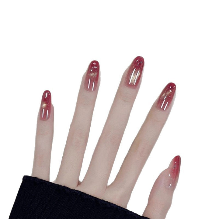 Glossy Ombre Nail Extensions with Gold Accents