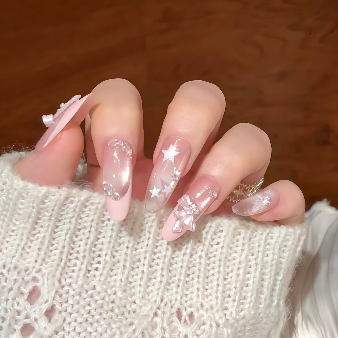 Artificial nail tips with glamorous glitter and bow details Stornfield