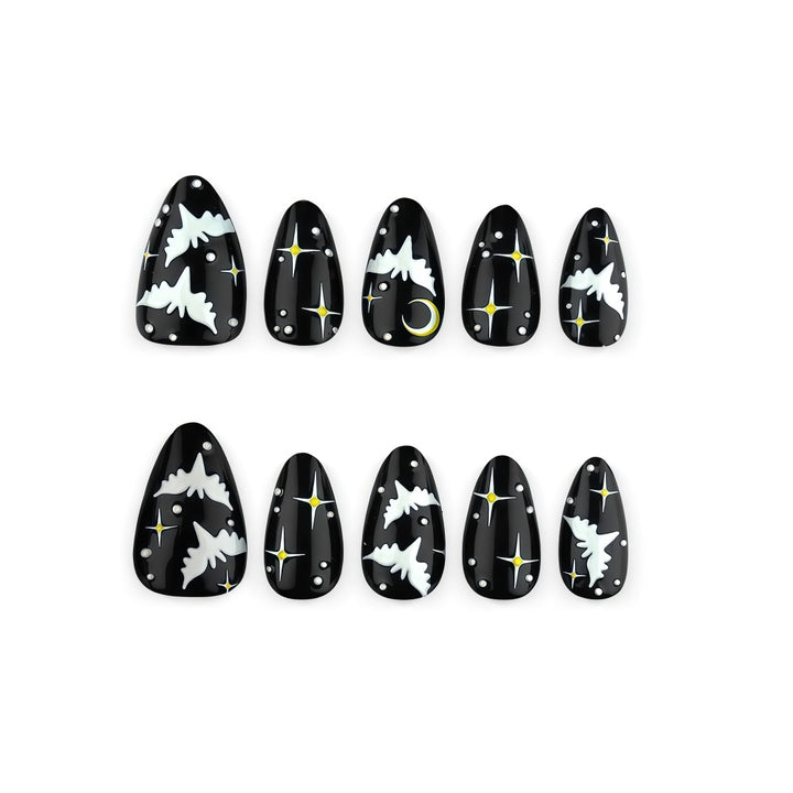 Artificial nails in creative Halloween bat design Stornfield