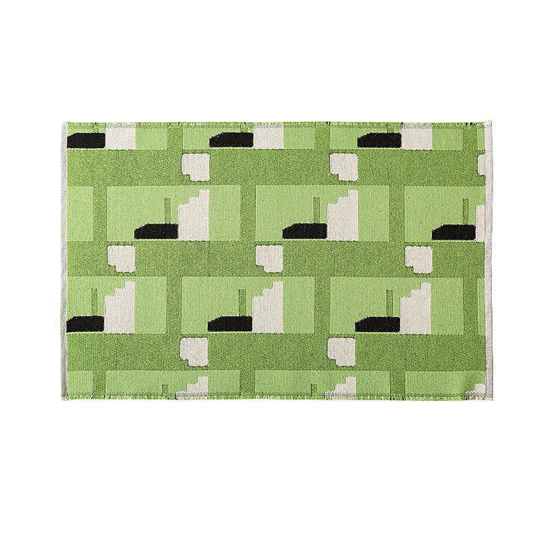 Flat-woven living room rug in a graphic tile pattern