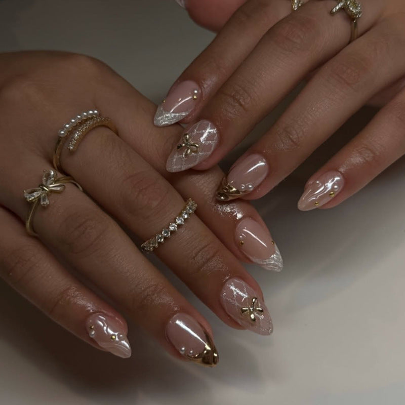 Artful stiletto nails with glitter and flower accents Stornfield
