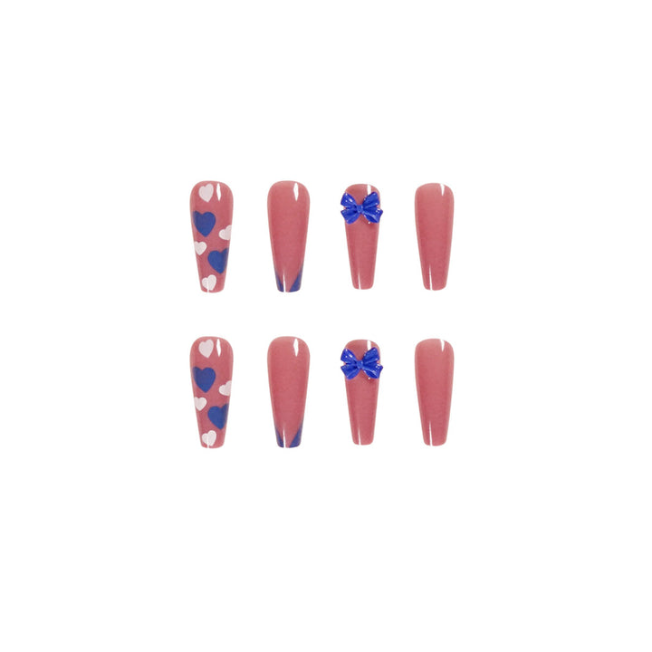Artful stiletto nails with modern heart and bow motifs Stornfield
